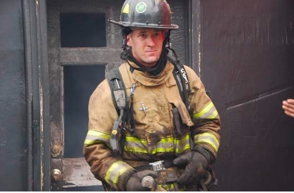 Firefighter exiting a structure. 