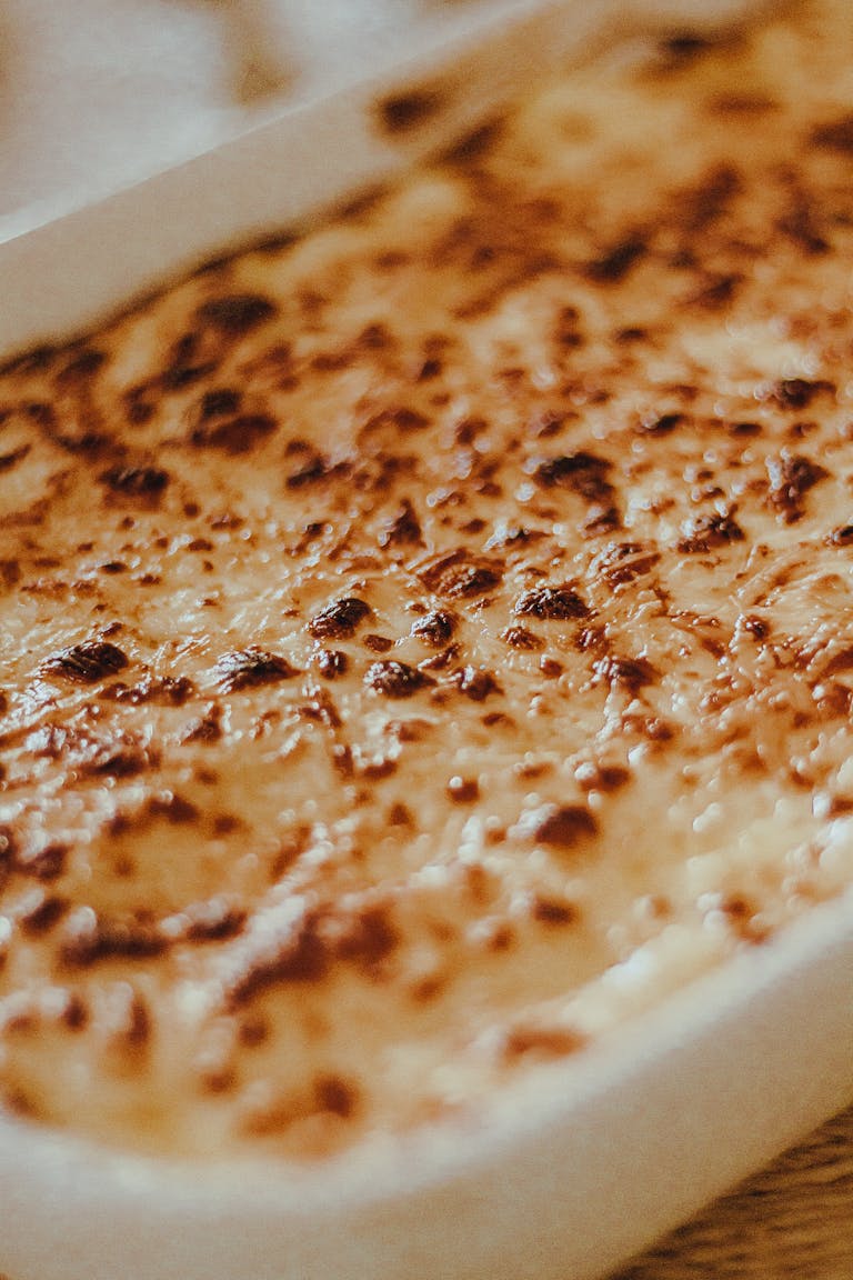 Close-up of a baked casserole with melted cheese